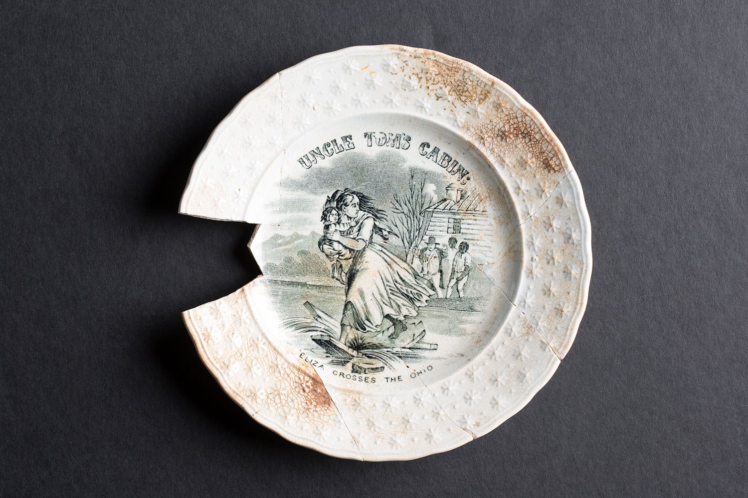 A plate adorned with a scene from Uncle Tom’s Cabin (Photo courtesy of Timmins Martelle Heritage Consultants Inc. and Infrastructure Ontario)