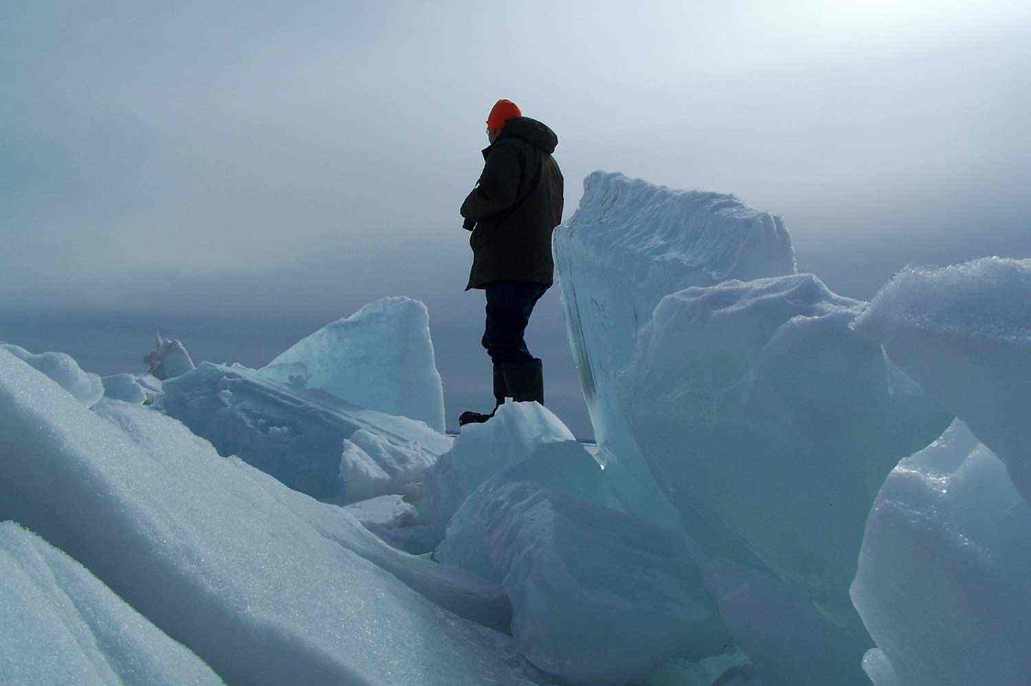 Fieldworker on ice ridges overlooking Lake Nipissing at Great Manitou Island, 2010.